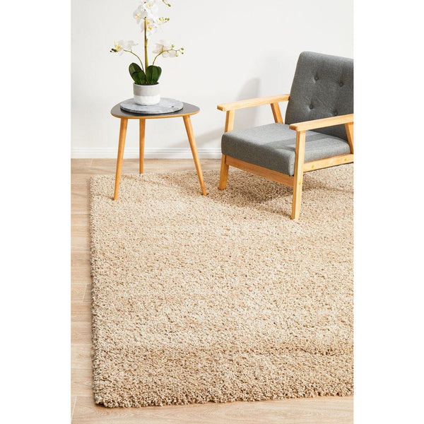 Beige linen modern shaggy rug with thick, soft polypropylene pile in a bright room setting.