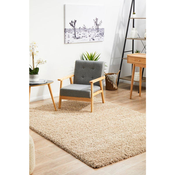 Beige linen modern shaggy rug with thick polypropylene pile in a bright living room setting.