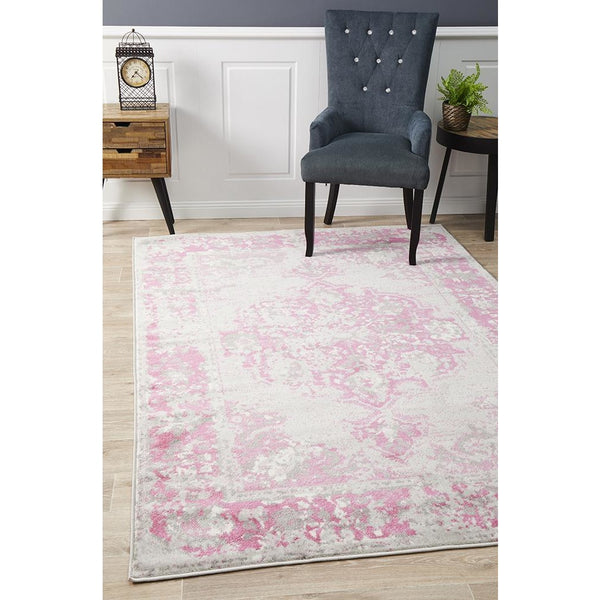Transitional abstract rug with fuchsia, beige, and grey tones in a soft, patterned design.