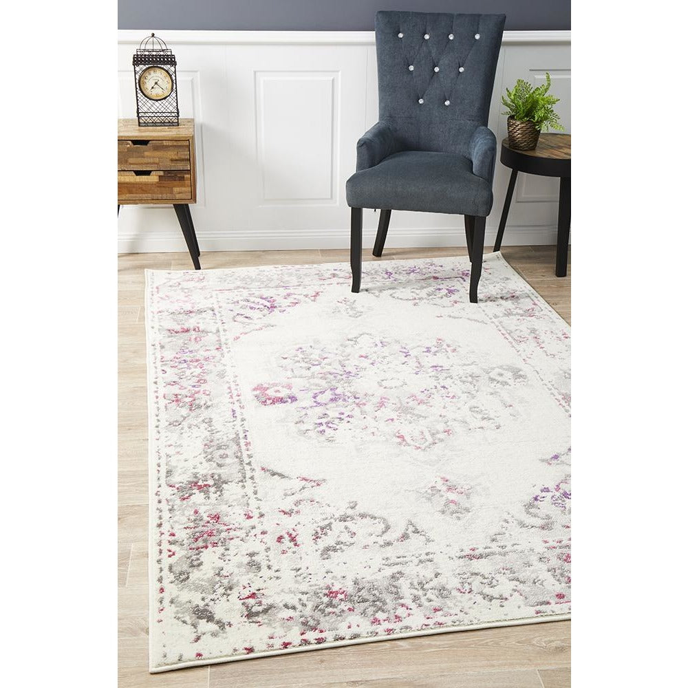 Pink beige and grey abstract transitional rug with soft patterned design on light background.