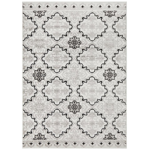 Modern floral abstract rug with black and grey patterns on beige background.