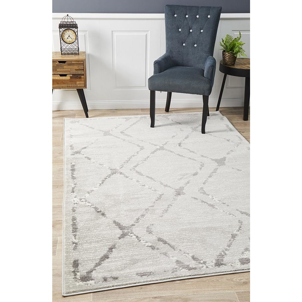 Silver grey beige rug with modern abstract diamond pattern and subtle textured weave.