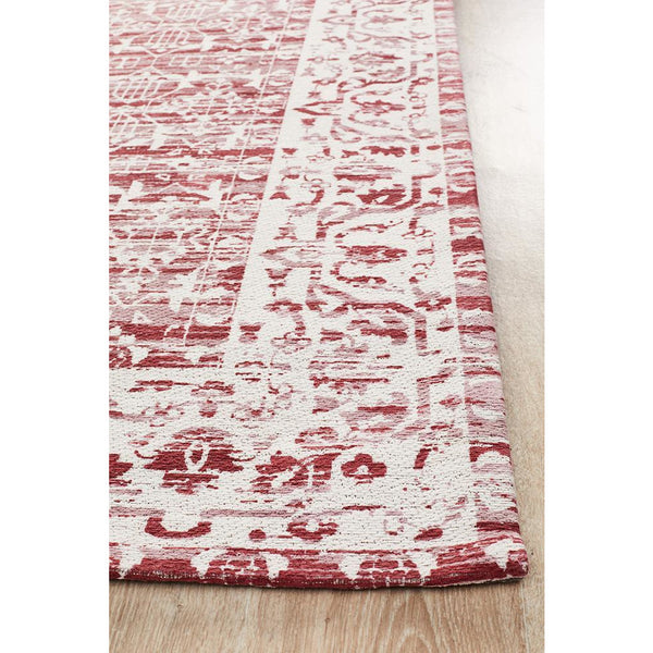 Red and cream patterned transitional rug with intricate floral and geometric jacquard design.