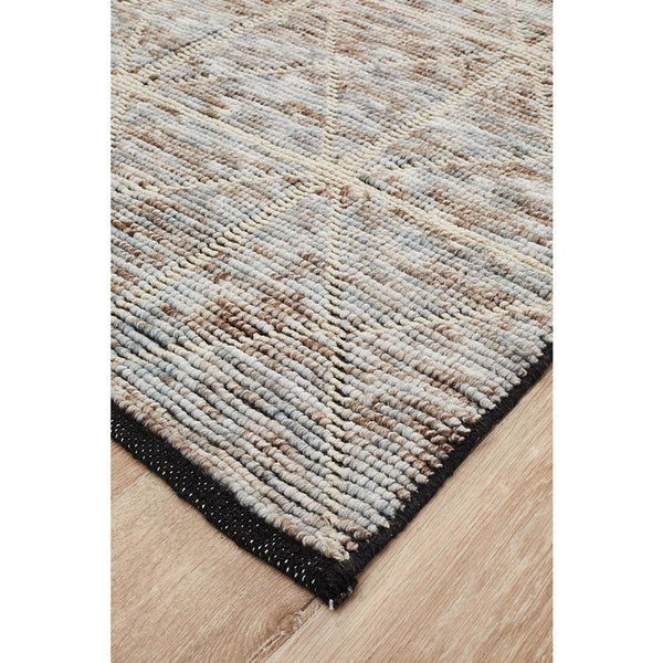Beige cross pattern modern flat-weave rug with multi-colored textured threads and black border.