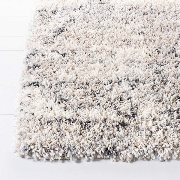 Cream and gray modern trellis patterned shaggy rug with 45mm polypropylene pile on white floor.