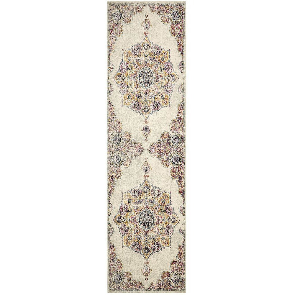 Transitional bohemian runner rug in bone with intricate multicolored floral medallion patterns and rust accents.