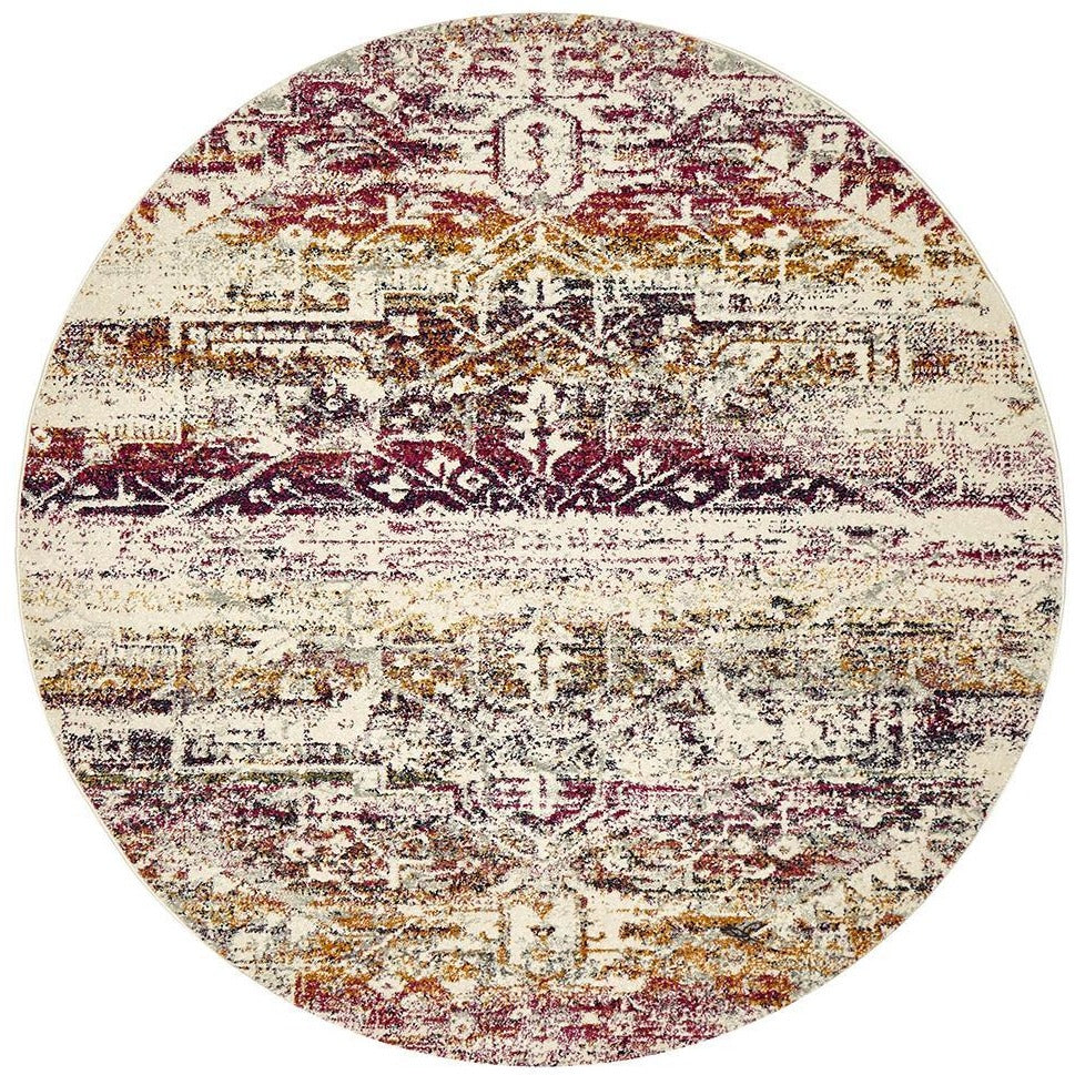 Round fuchsia multi-colored transitional bohemian rug with intricate distressed patterns.