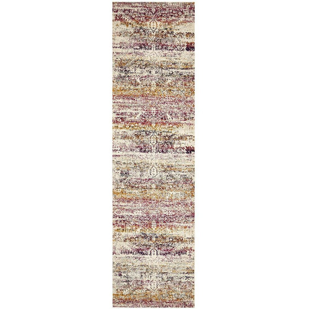 Transitional bohemian runner rug with fuchsia, beige, and multi-colored abstract patterns in a textured weave.