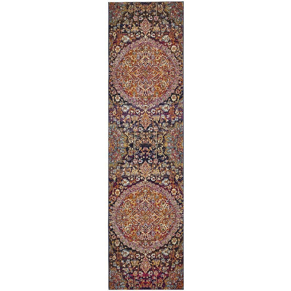 Bohemian-style runner rug with pink, rust, and multicolored intricate medallion patterns.