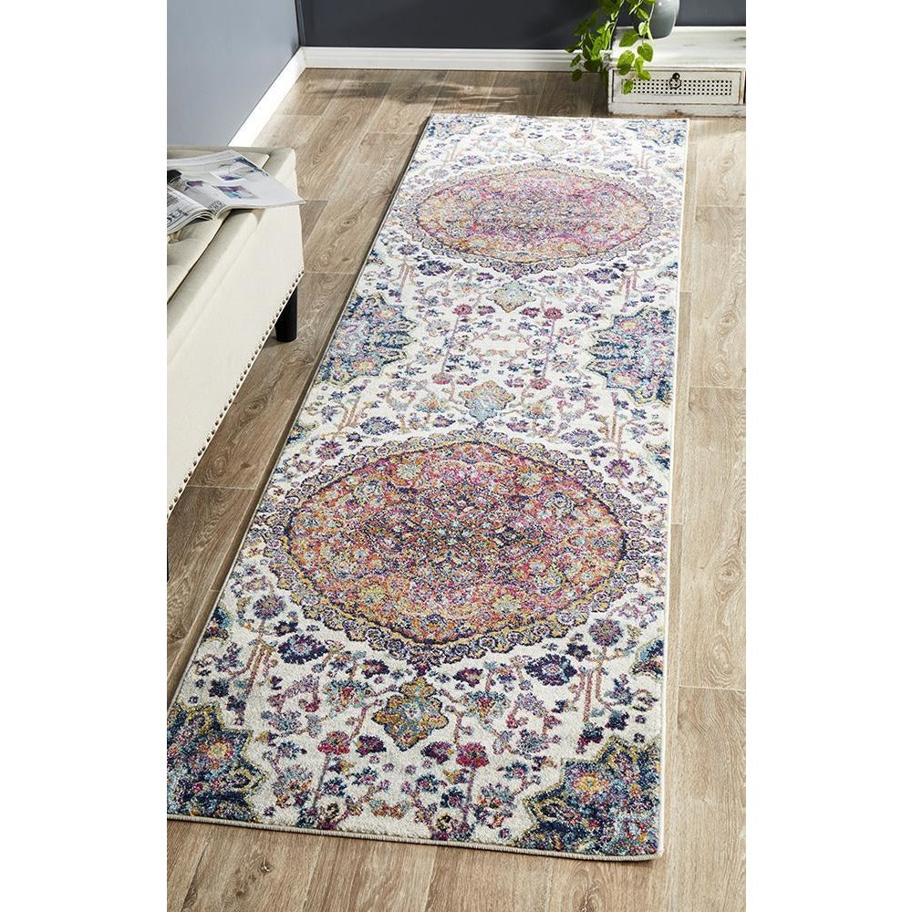 Rust and beige bohemian runner rug with intricate multicolored medallion patterns on a light background.