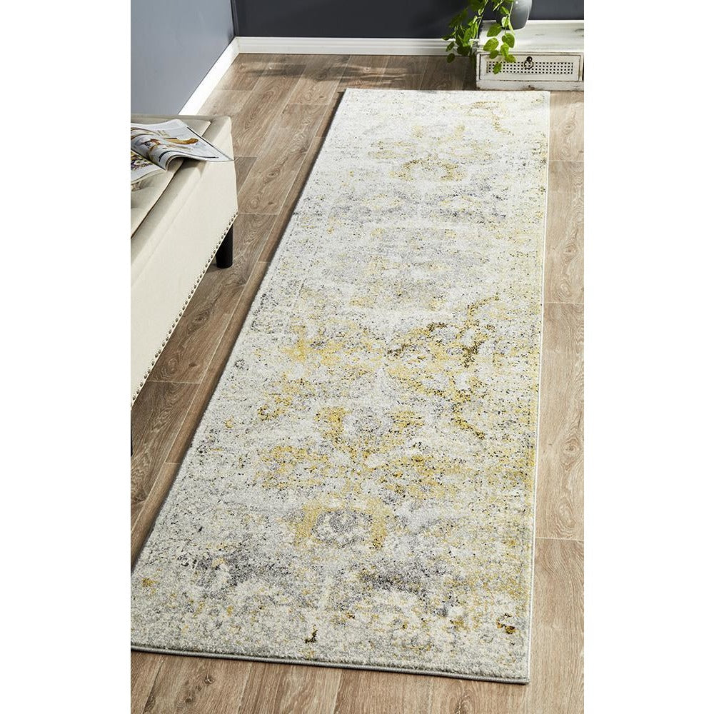 Silver grey runner rug with subtle bohemian-inspired floral and abstract patterns on a soft textured weave.
