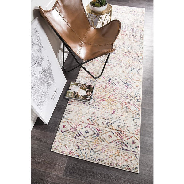 Multi-colored modern tribal runner rug with geometric patterns on light background.