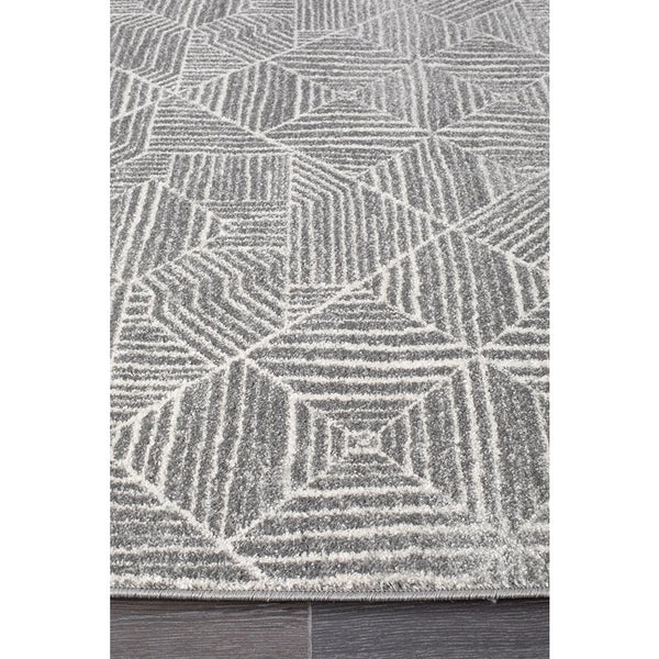 Silver grey tribal pattern boho rug with textured geometric diamond shapes.