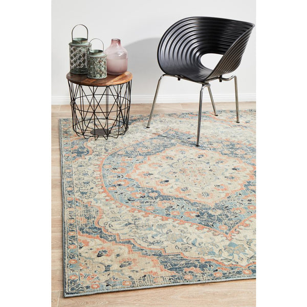 Rectangular navy blue multi-color transitional rug with ornate floral patterns and distressed finish.