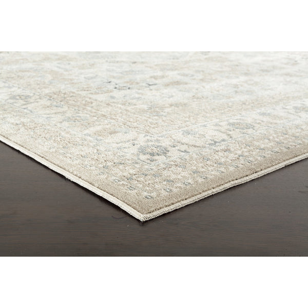 Beige and green traditional patterned rug with faded decorative border, soft chenille texture.