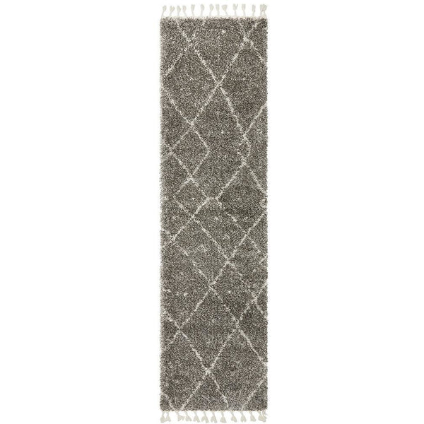 Grey shaggy runner rug with white Moroccan diamond pattern and fringed edges.