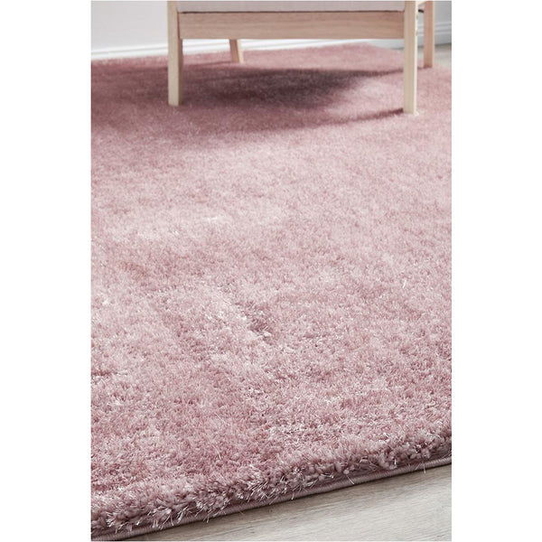 Soft blush pink shaggy rug with a plush polyester pile and subtle texture detail.