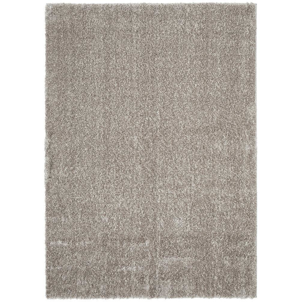 Rectangular modern soft shaggy rug in beige mink color with dense polyester pile.