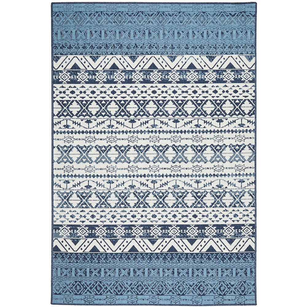 Rectangular indoor-outdoor rug with blue and white tribal geometric patterns and textured polypropylene weave.