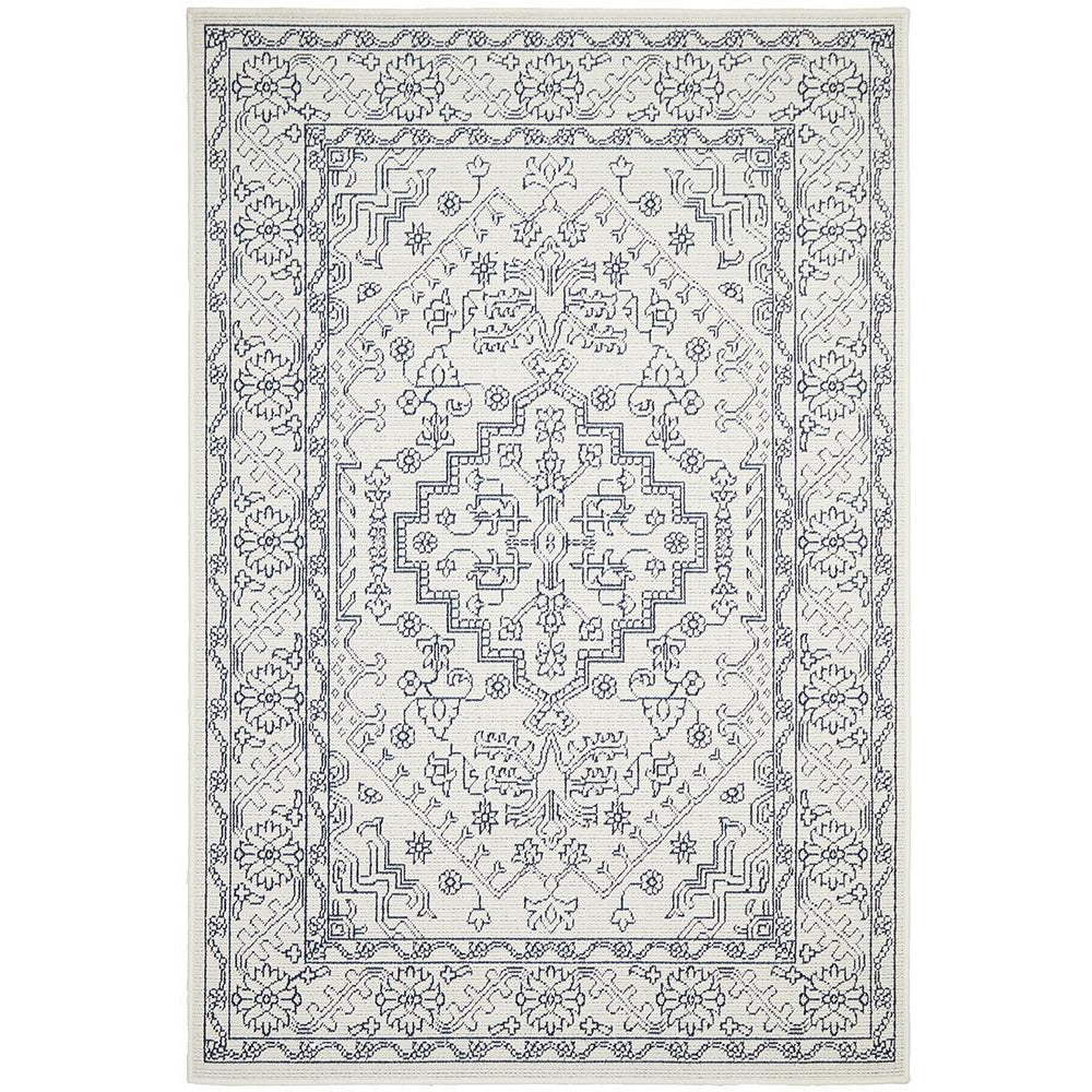 White and grey rectangular rug with intricate tribal patterns and traditional border design.