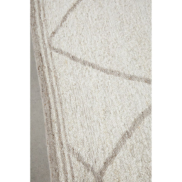 Close-up of Manly 2245 modern wool blend rug with neutral beige geometric flatwoven design.