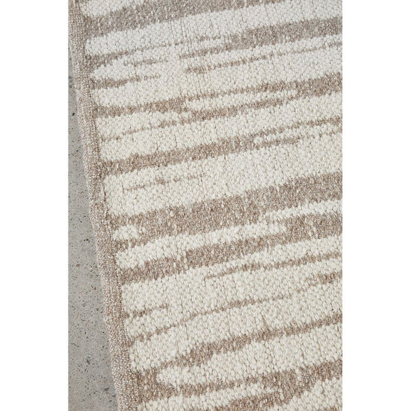 Neutral-toned wool blend rug with abstract linear pattern in beige and cream tones.
