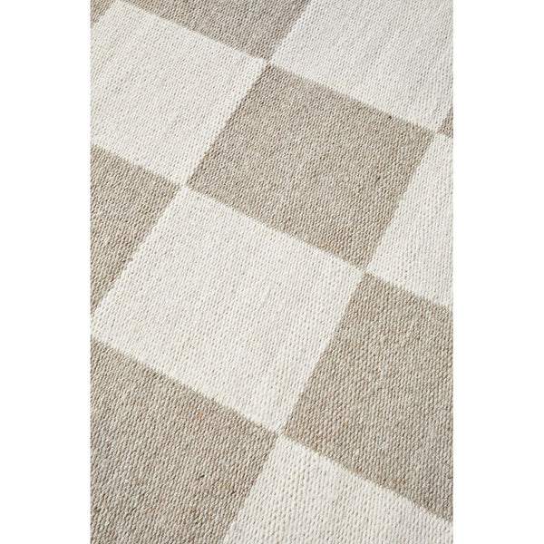Neutral-toned wool blend rug with a soft checkerboard pattern in beige and cream.